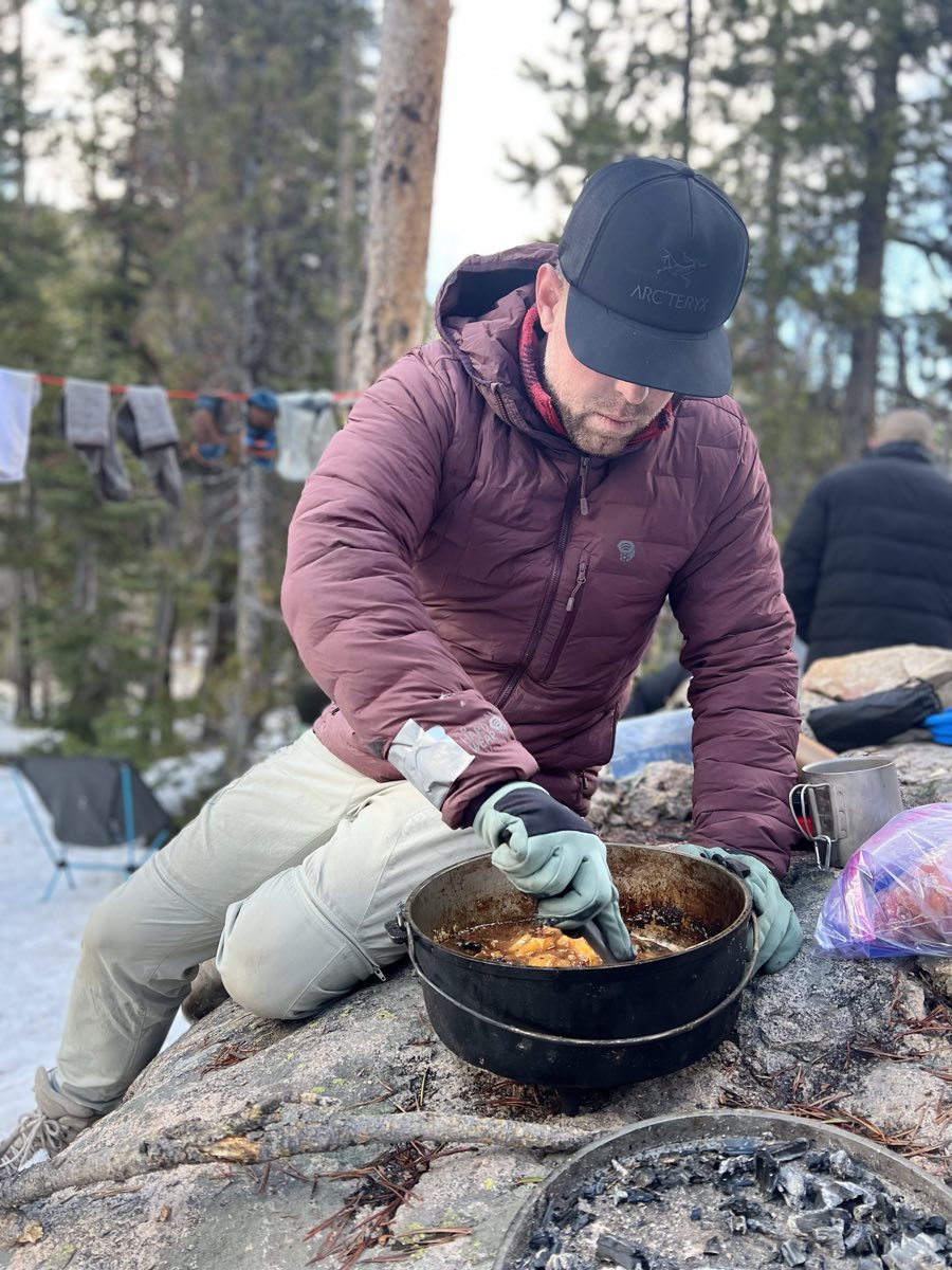 Cooking in a dutch oven at camp