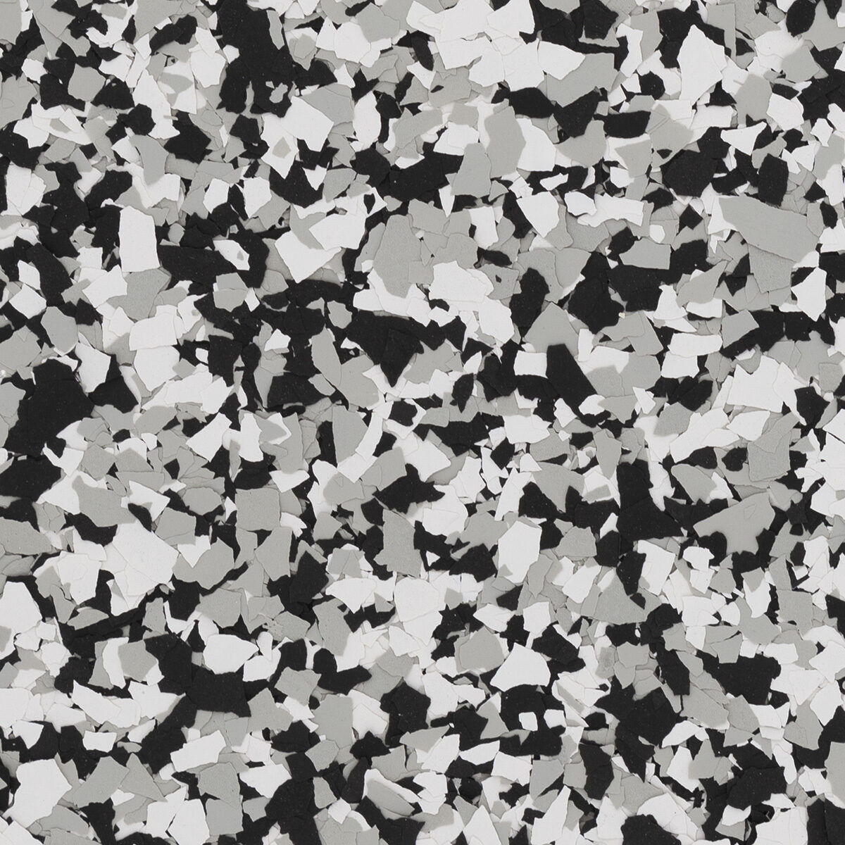 Domino flake blend spread across a floor: black and white