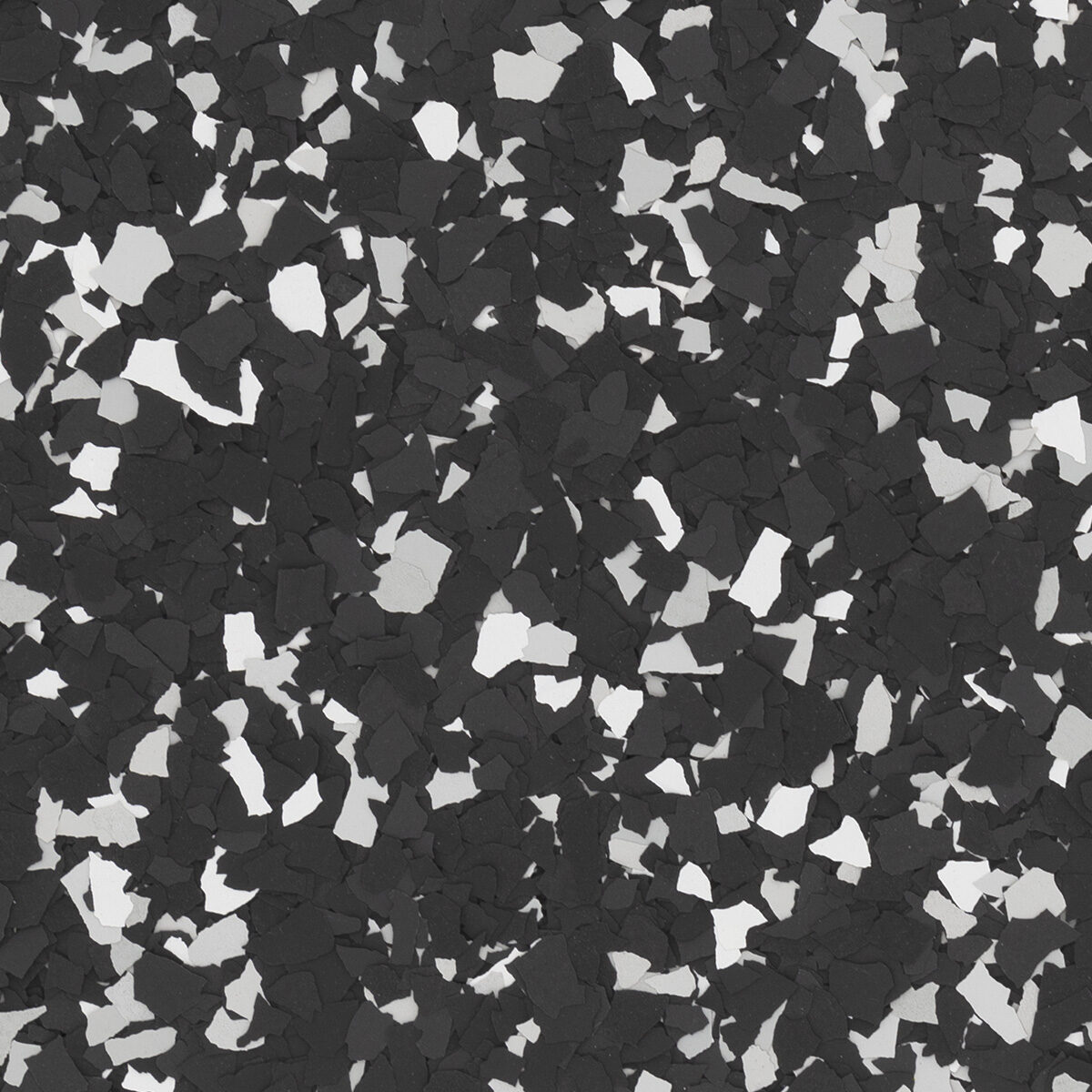 Raven flake blend spread across a floor: black with white