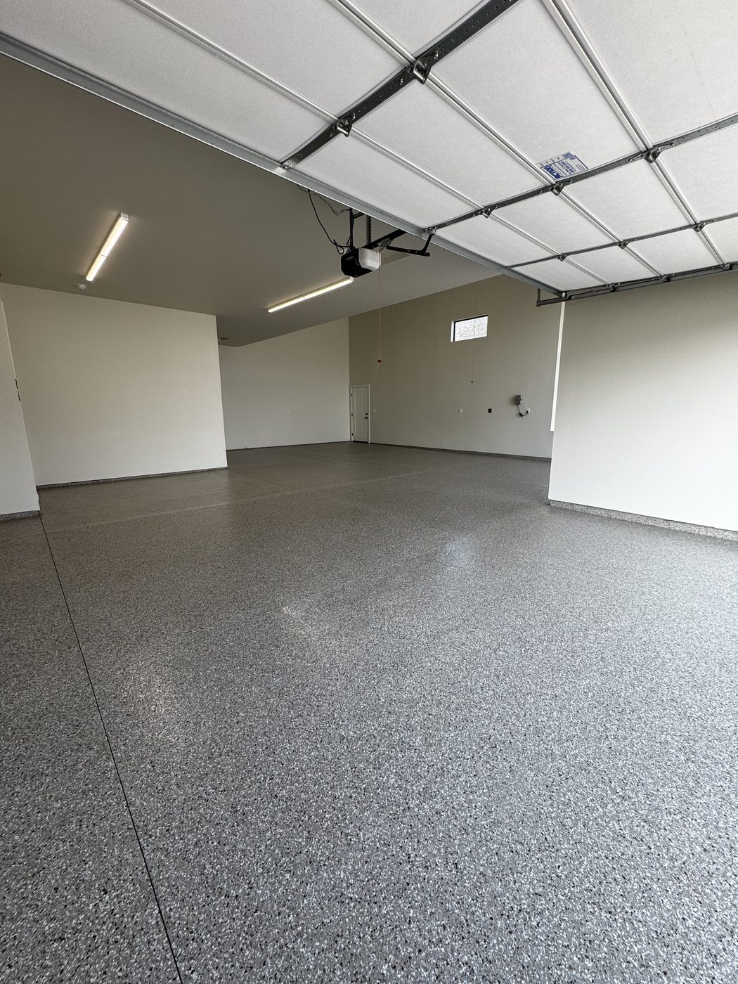 Finished flake floor across a large garage interior