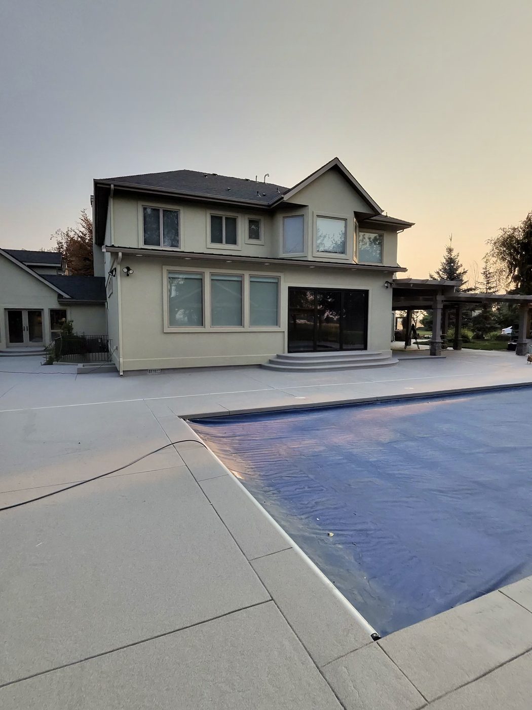 Pool and coated deck at dusk